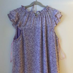 light purple floral tank top with ruffle sleeves. never worn
